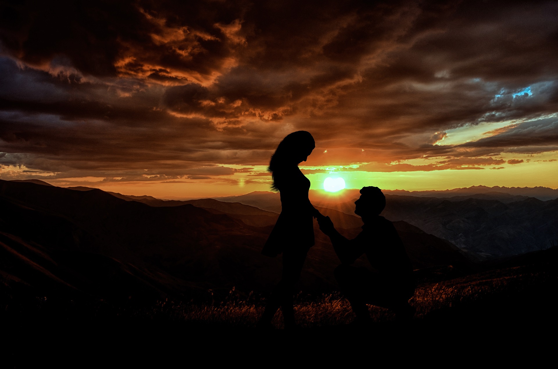 Proposal with sunset behind couple