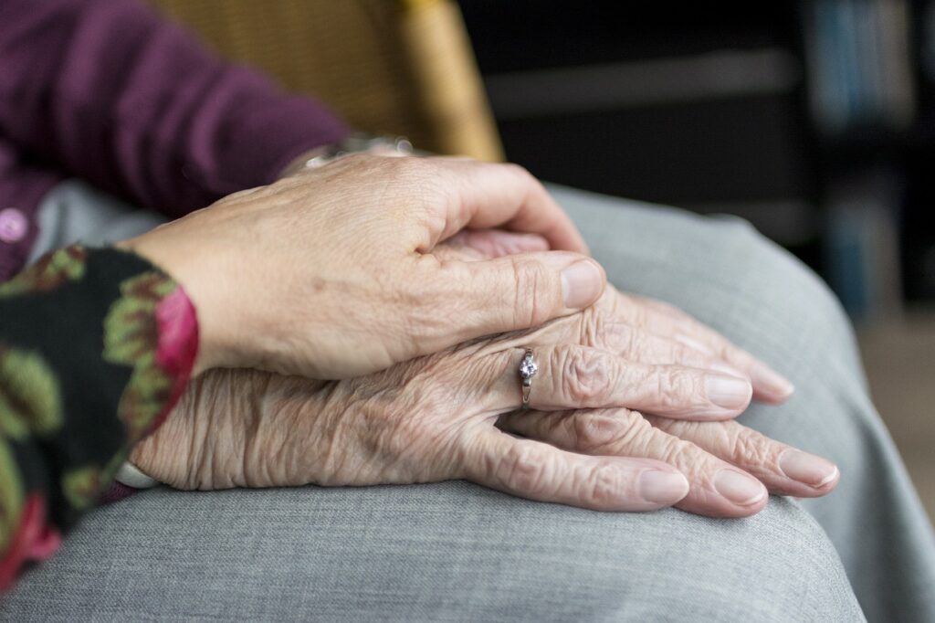 Holding Elderly Mothers Hands Photo